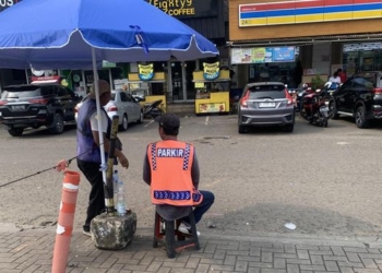 Suara Juru Parkir Minimarket di Tengah Stigma Negatif Tukang Palak